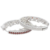 Elegant round red garnet sterling silver earrings with intricate design, showcasing sparkling gemstones and sophisticated style.